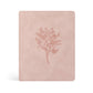 Pink bible with floral design on a white background